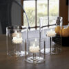 Trio de photophore transparents Clarisse sur une table en bois